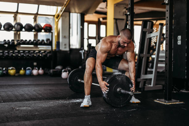 istock Exercising in the gym 1169478107