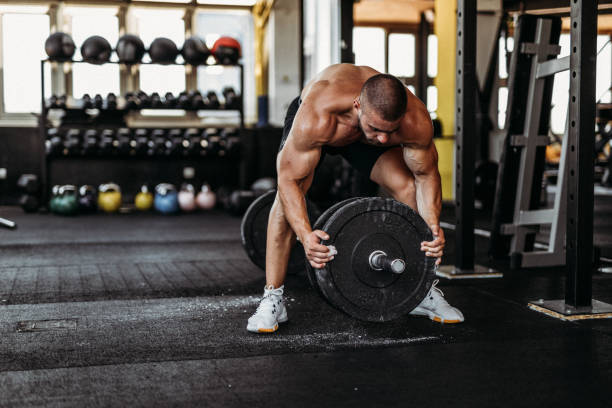 istock Exercising in the gym 1169478839
