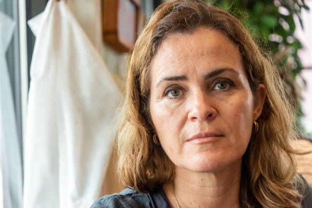 istock Sad mature woman looking at the camera 1169479449