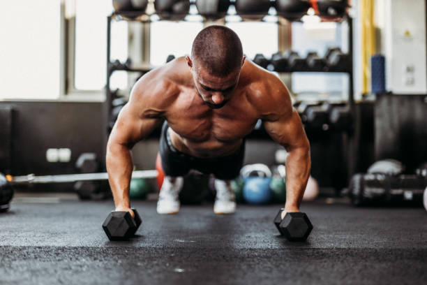 istock Exercising in the gym 1169479834