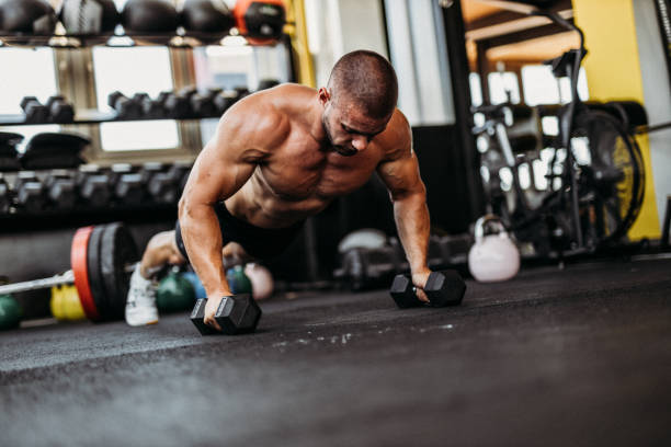 istock Exercising in the gym 1169479863