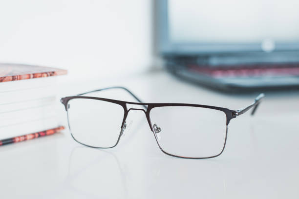 istock Glasses with book and laptop 1169481962