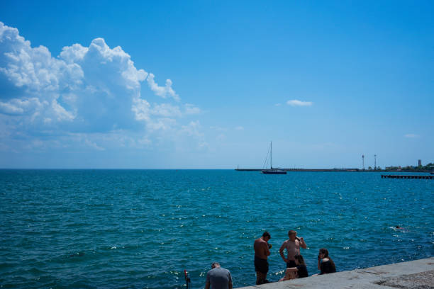Evpatoria, Crimea - may 24, 2018: Seascape with people on the city's waterfront.