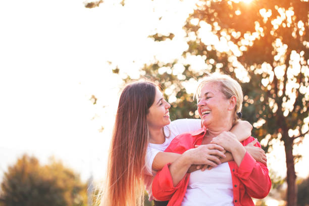istock Smiling mother with young daughter 1169484587
