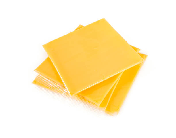 istock cheese slices isolated on white background 1169487854