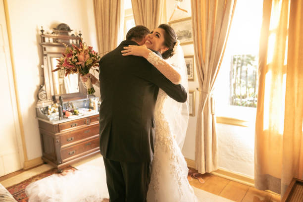 Bride and father embracing before wedding ceremony Bride and father embracing before wedding ceremony bride hugging father on wedding day stock pictures, royalty-free photos & images