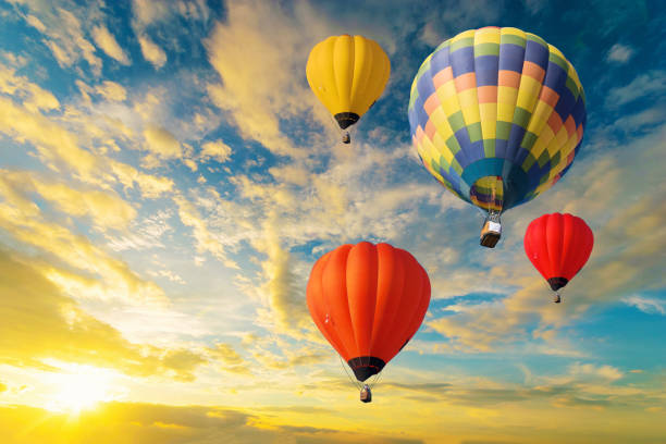 istock Colorful balloons floating in the sky at sunset. 1169489999