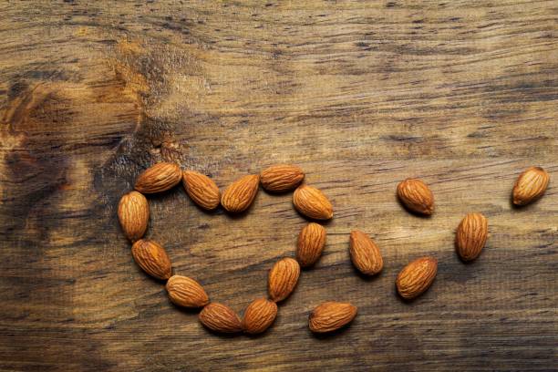 istock Heart shape of almonds 1169490072