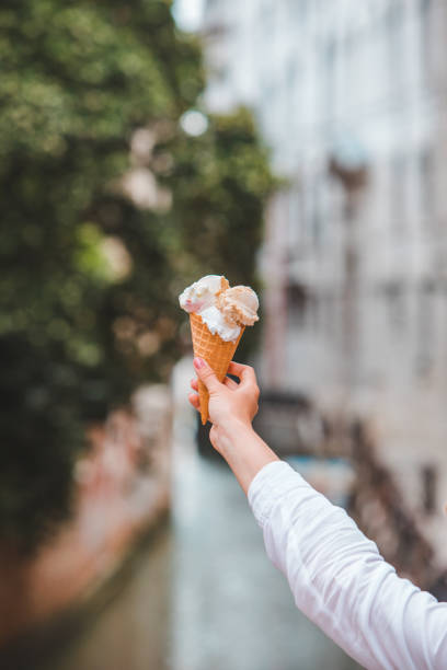 istock ice cream in woman hand 1169494917