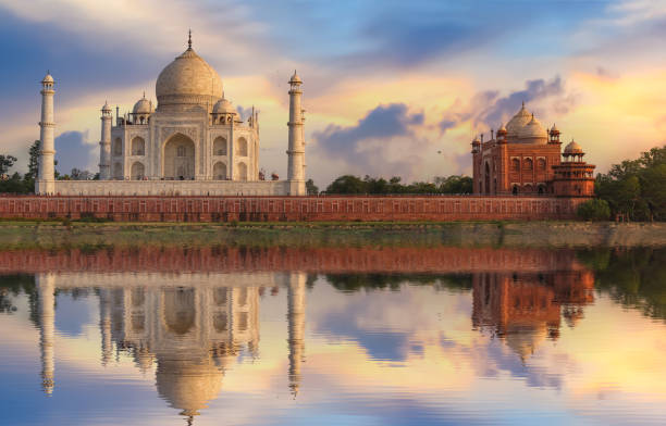 istock Taj Mahal Agra as seen from Mehtab Bagh at sunset with mirror reflection on Yamuna river. 1169495253
