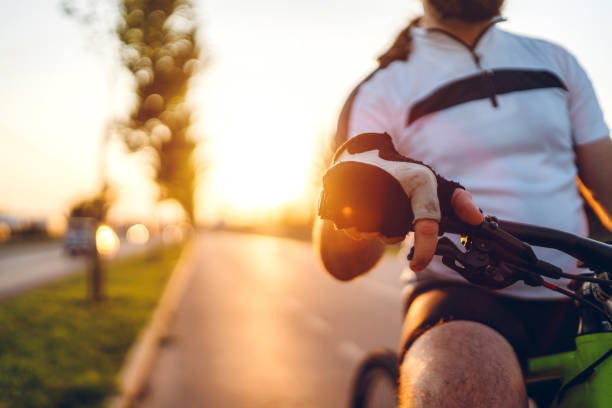 istock Cyclist is on the sunset road 1169497013