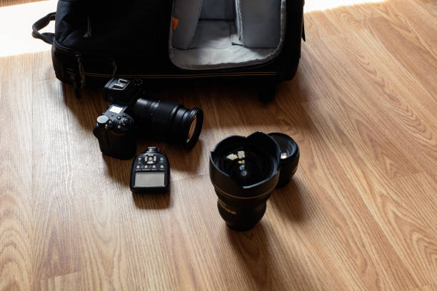 istock Photographer equipment is lying on the floor by the backpack. 1169499078