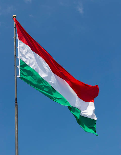 istock Hungarian flag on blue sky 1169500641
