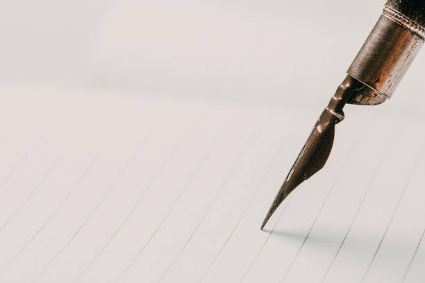 istock diary with fountain pen on white close-up 1169502160