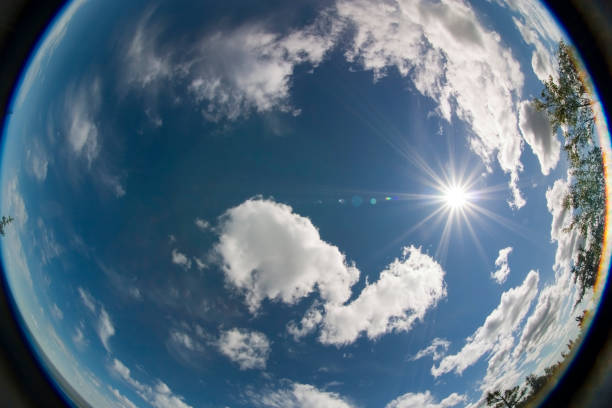cumulus clouds and the sun