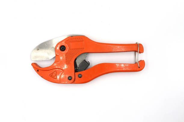 istock Red Pipe Cutting design, scissors for cutting plastic pipe isolated on white background High resolution image gallery. 1169503075