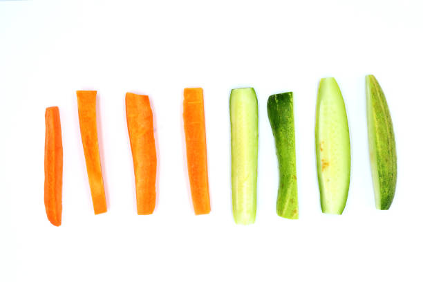 Fresh cucumber and carrots slice isolated on white background High resolution image gallery.