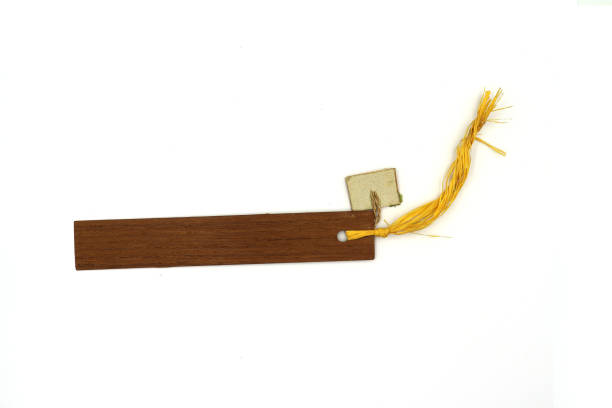 istock rustic wood tag with thin rope, wooden book mark isolated on white background High resolution image gallery. 1169503989