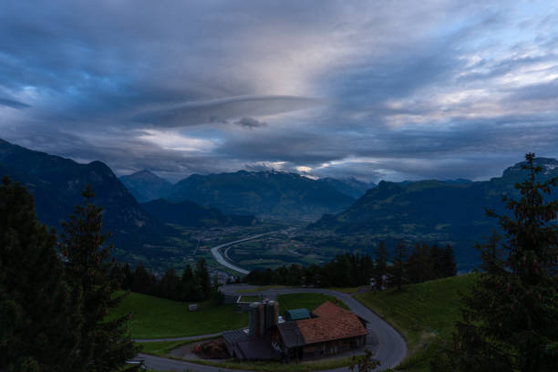 istock A mountain range and a green hill with some trees under a dramatic sky 1169507523