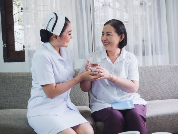 istock Nurses bring water to the elderly to drink 1169507605