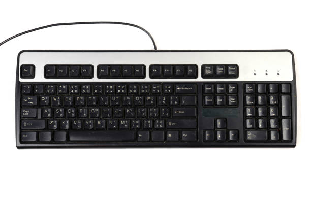 istock key board US Thai layout, dirty computer  key board, old key board, isolated on black background.