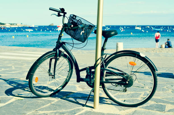 istock bicycle in a seafront on the Mediterranean sea, with a filter effect 1169509331
