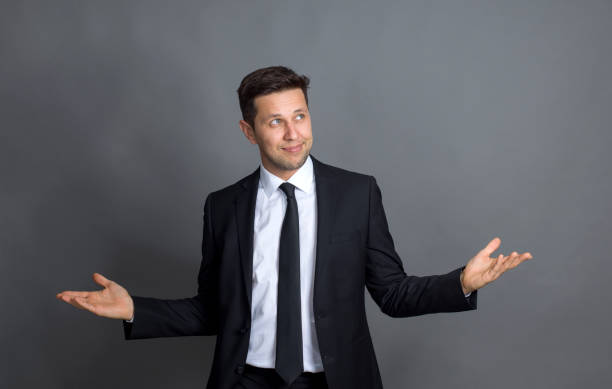 istock Confident young businessman welcoming you 1169513314