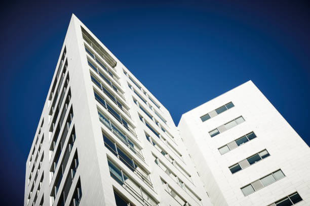 istock white skyscraber and a blue sky 1169515074