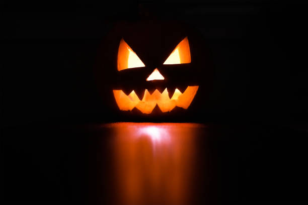 istock Halloween holiday celebration symbol, pumpkin glowing 1169515294