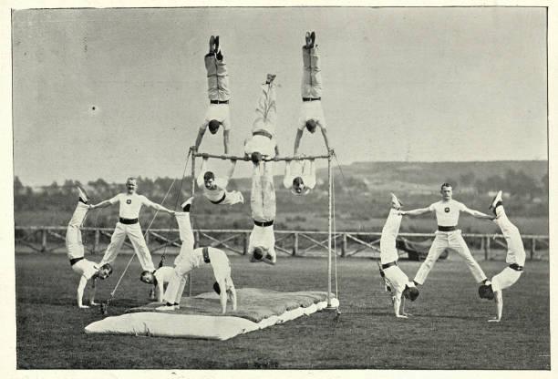 Army gymnastics team performing at Aldershot, 19th Century Vintage photograph of Army gymnastics team performing at Aldershot, 19th Century gymnastics bar photos stock pictures, royalty-free photos & images