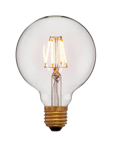 istock Closeup vintage retro Edison lamp isolated on white background. 1169519086