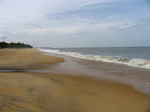 Stretch of sand and waves, Kappad beach, Kerala, India