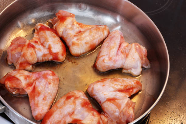 istock Marinated chicken wings. Wings in ketchup 1169520620
