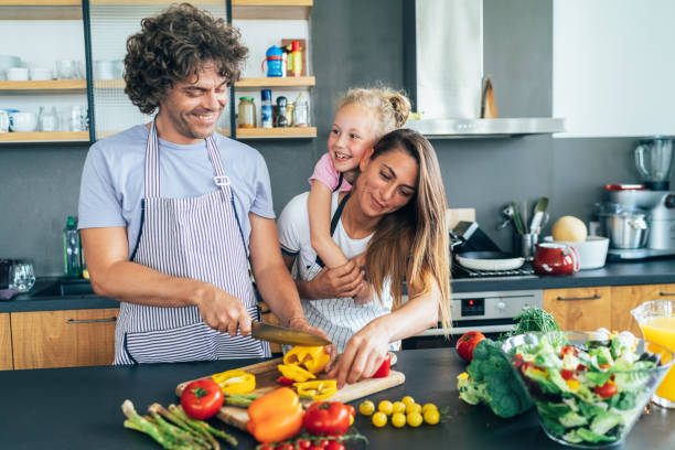 istock Happy family in the kitchen 1169521085
