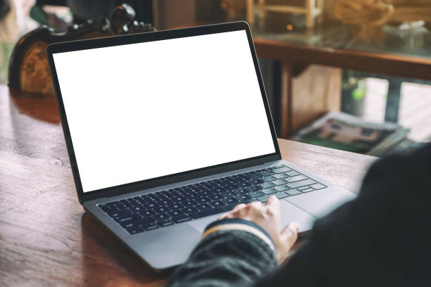 istock a woman using and touching on laptop touchpad with blank white desktop screen 1169522138