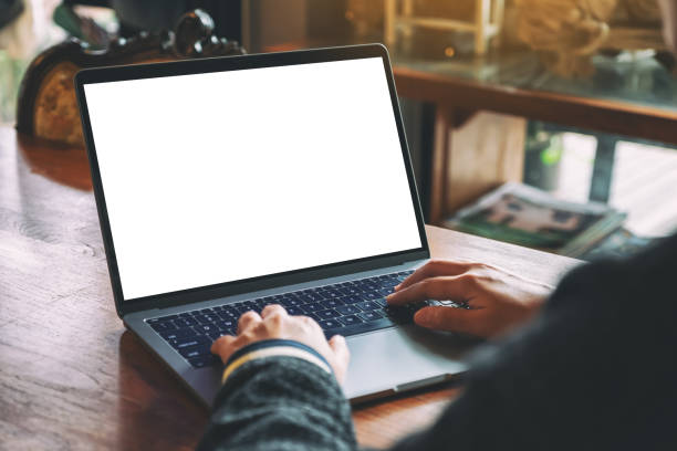 istock a woman using and typing on laptop keyboard with blank white desktop screen 1169522139