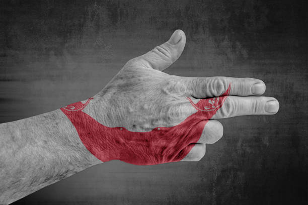 Hand showing shaka gesture on golden background