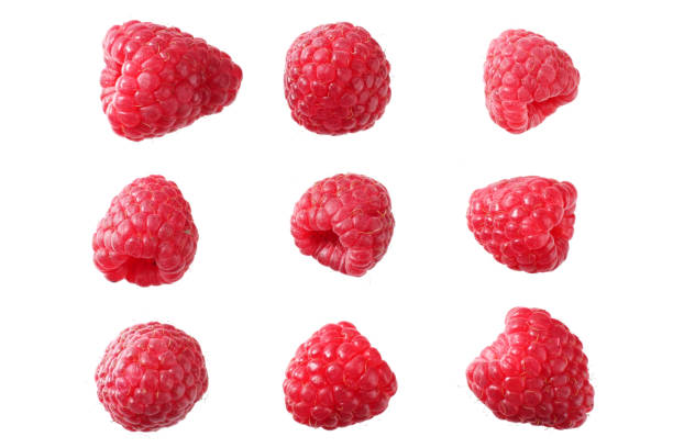 istock ripe raspberries isolated on white background macro 1169523042