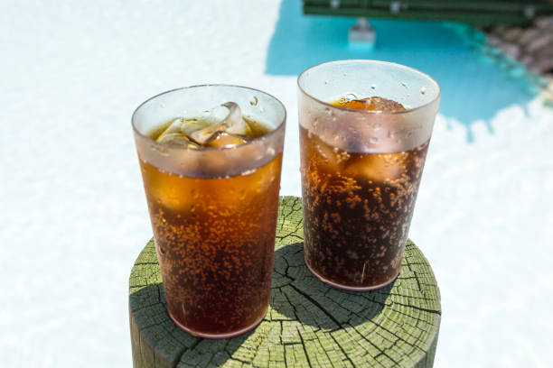 istock Glasses with cola and ice at the pool 1169524883