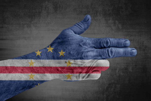 Cape Verde flag painted on male hand like a gun