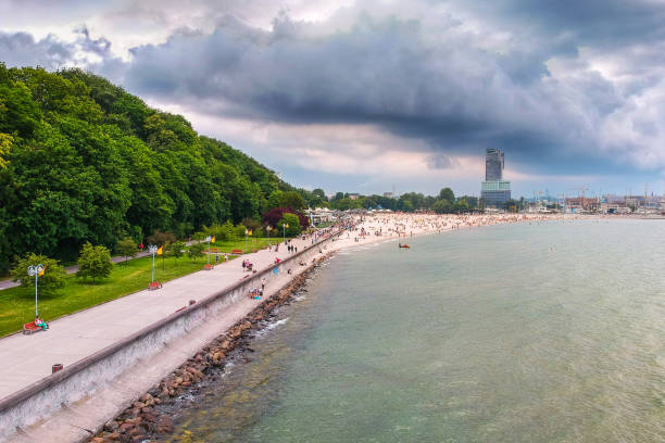 People on the beach at Baltic Sea in Gdynia, Poland.