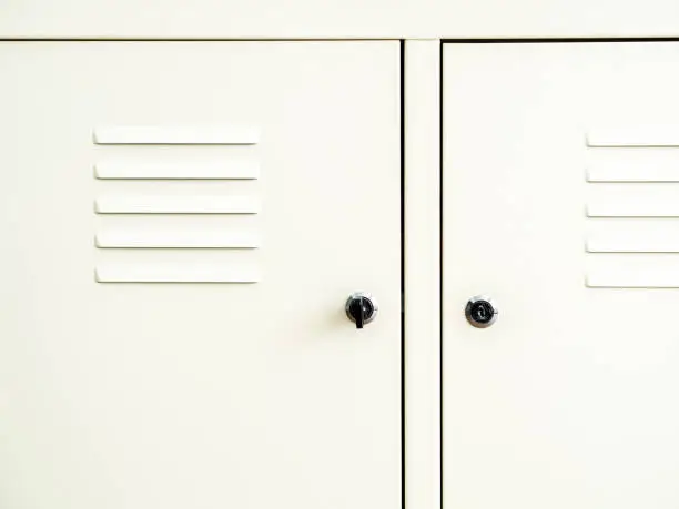 Photo of Closed white lockers close-up