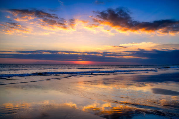 istock Magic Dramatic Unreal Sunset in Seminyak beach, Bali, Indonesia 1169528195