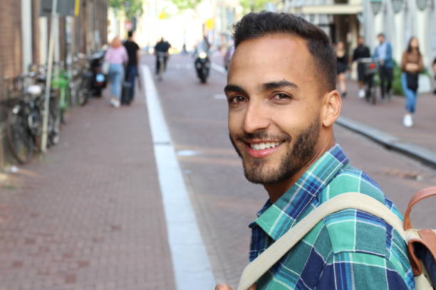 istock South American young man smiling outdoors 1169529792