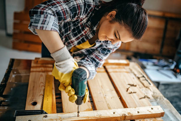 istock Woman screwing with drill 1169529810