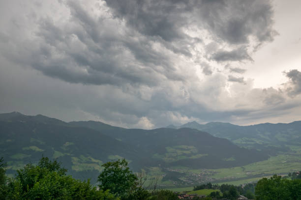 istock Dramatic sky of a thunderstorm cloud over the Alps, central Europe 1169530857