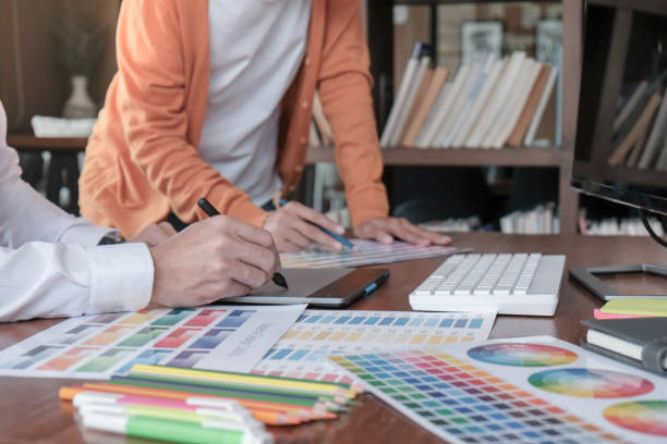 istock Graphic designer working on digital tablet. artist drawing on graphic tablet and Color swatch samples. 1169531121