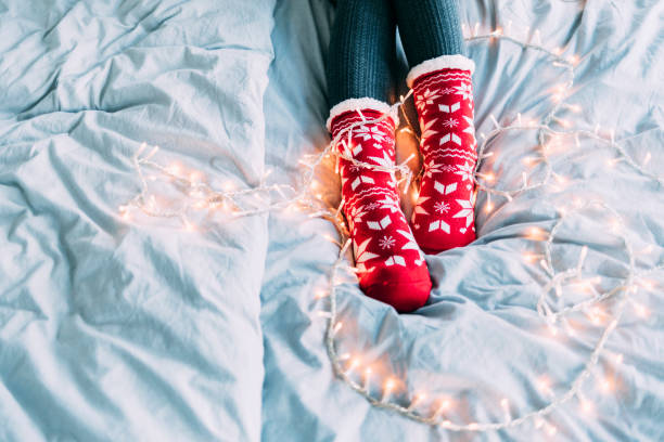 istock Woman sitting christmas socks 1169531140