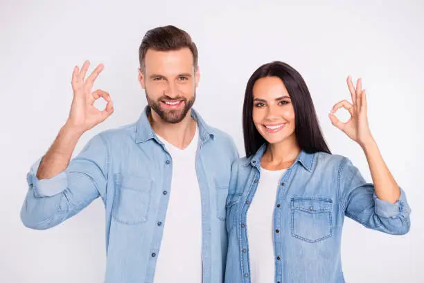 Close-up portrait of his he her she nice, attractive shine lovely charming cheerful cheery glad positive persons showing two double ok-sign ad advert isolated over light white pastel background