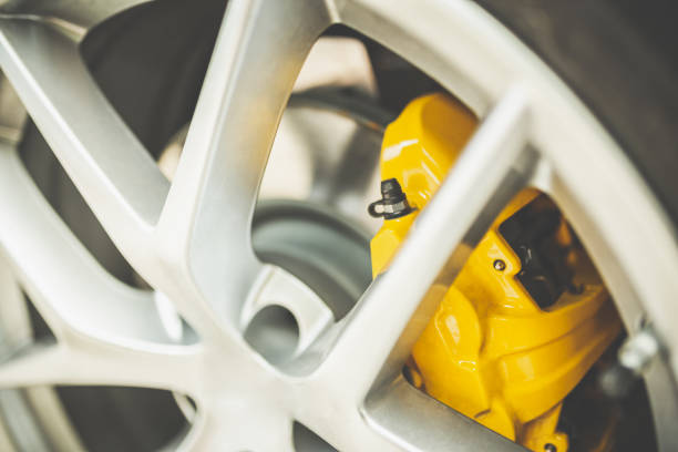 Close up of a modern sport wheel with yellow brake